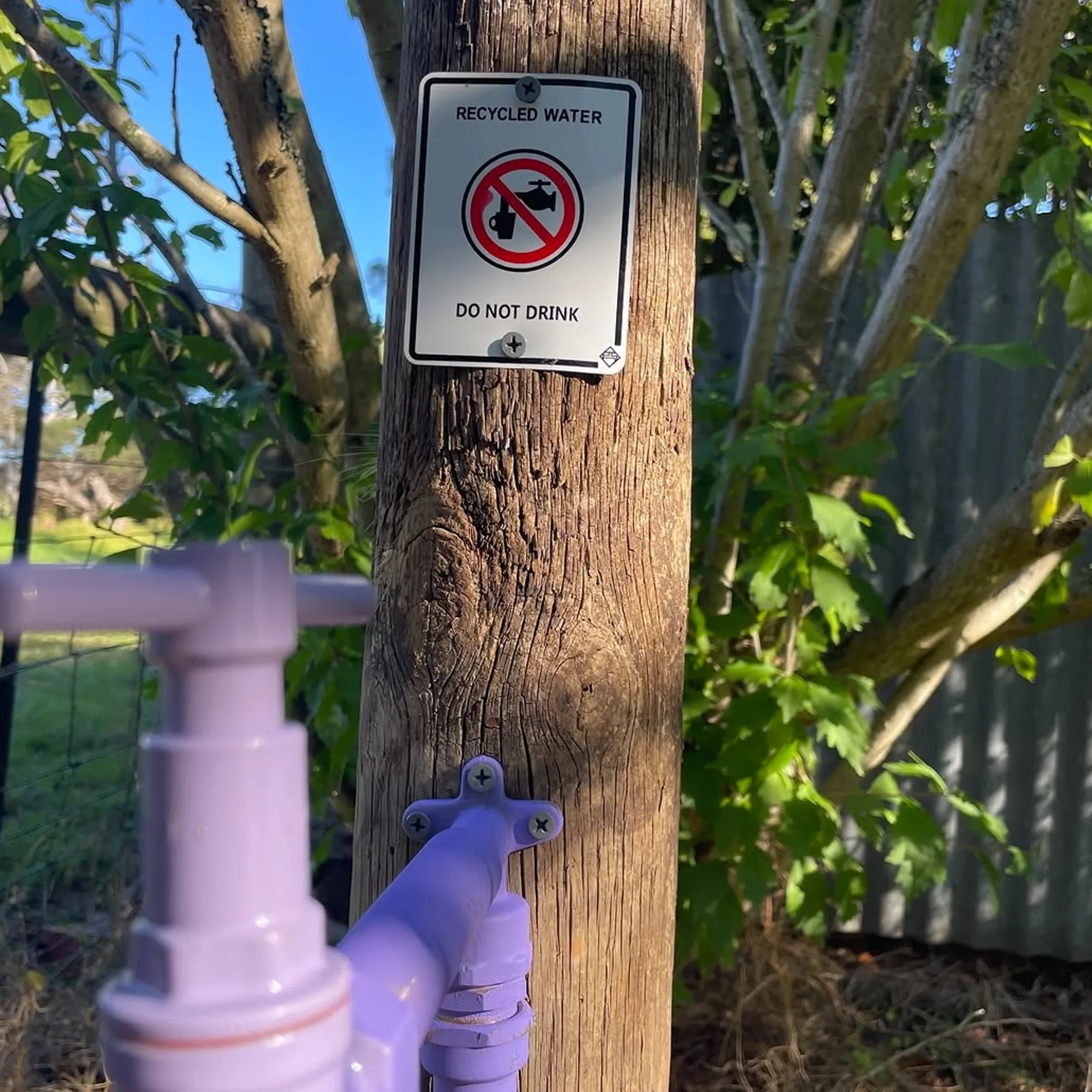 recycled water tap and sign